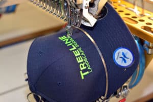 Custom embroidered hat featuring a detailed logo design, showcasing high-quality stitching from C&A Embroidery's professional embroidery services.